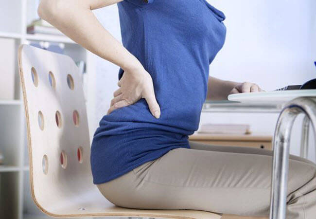 Болит спина от сидячей работы? Советы для женского здоровья